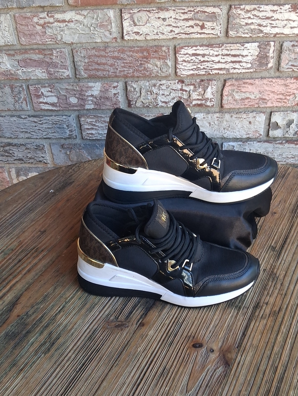 MICHAEL Michael Kors Black and Gold Wedge Sneakers